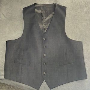 This vest is charcole and blue stripe plaid size fits sizes but 44-52 mdn/cls